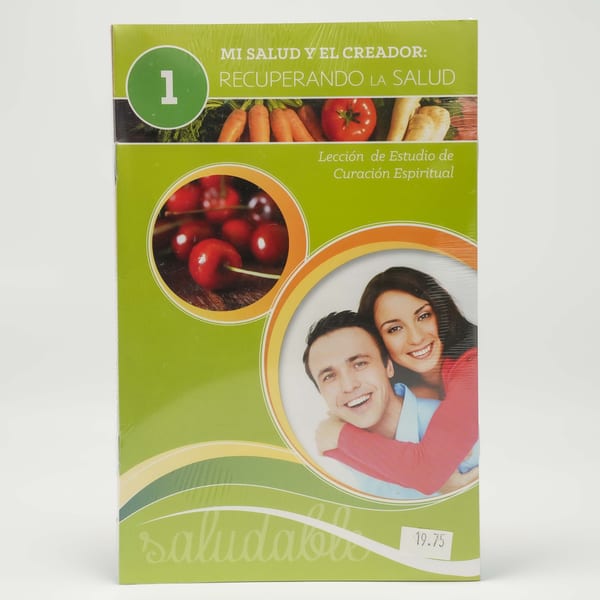 Green book cover with images of vegetables, cherries, and a smiling couple, titled "Mi Salud y el Creador".