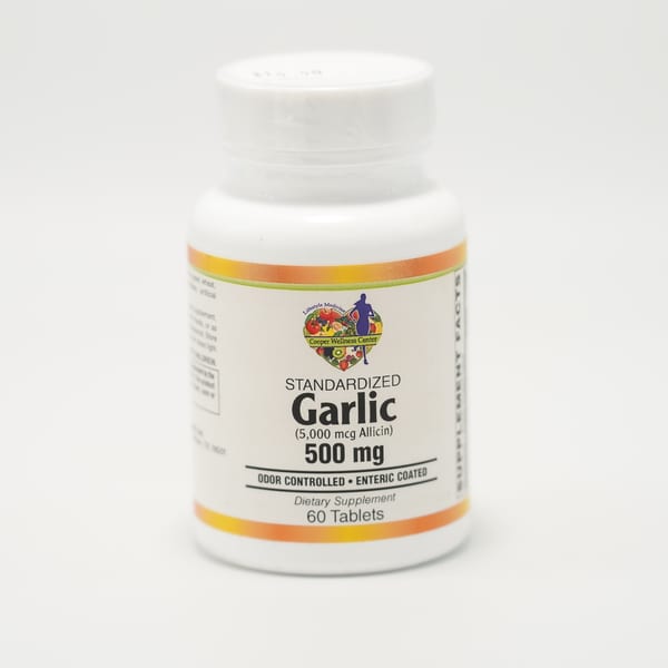 White bottle of Cooper Wellness Center Standardized Garlic 500mg dietary supplement with 60 tablets.