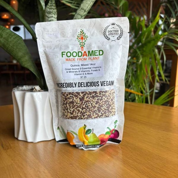 Foodamed quinoa package on a wooden table next to a potted plant.