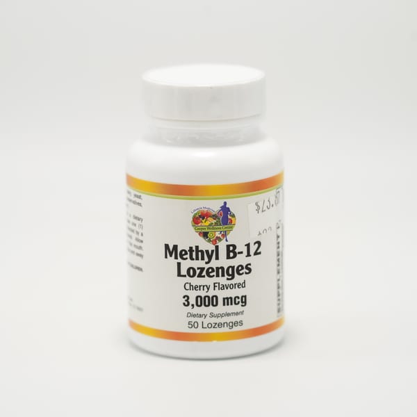 A white bottle of Cooper Wellness Center Methyl B-12 Cherry Flavored Lozenges on a white background.